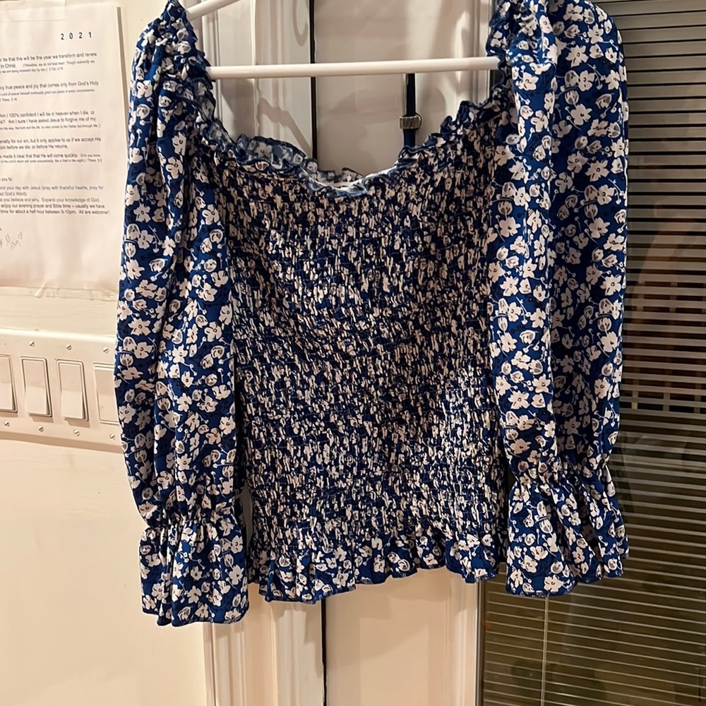 White flowered blue top